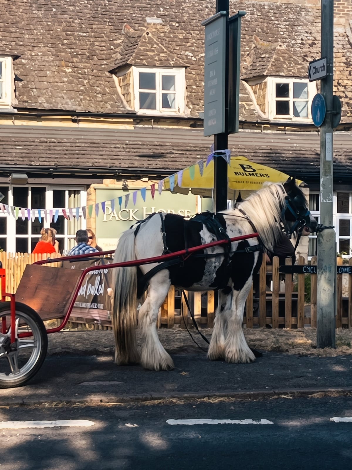 A horse and cart outside the pub